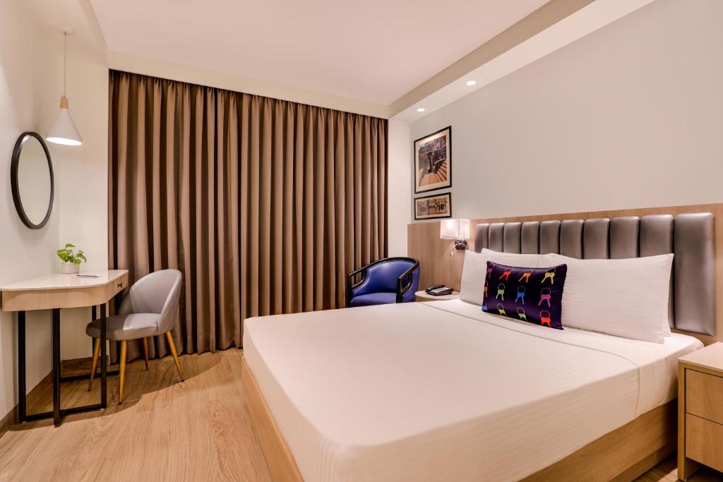Postel nebo postele na pokoji v ubytování Keys Prima by Lemon Tree Hotels, Pimpri, Pune