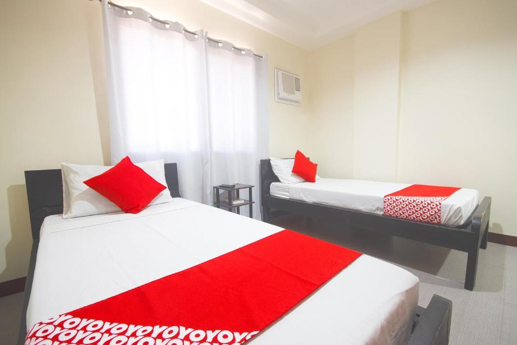 Postel nebo postele na pokoji v ubytování OYO 567 Blue Horizon Hostel