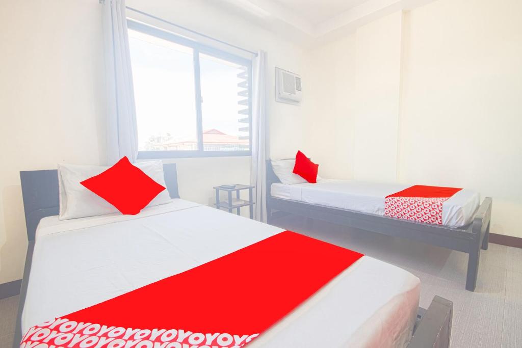 Postel nebo postele na pokoji v ubytování OYO 567 Blue Horizon Hostel