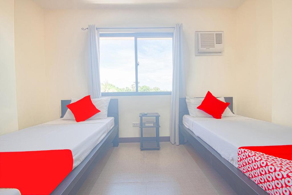 Postel nebo postele na pokoji v ubytování OYO 567 Blue Horizon Hostel