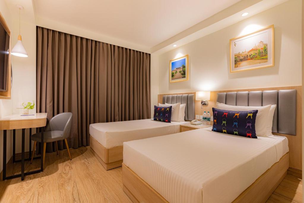 Postel nebo postele na pokoji v ubytování Keys Prima by Lemon Tree Hotels, Pimpri, Pune