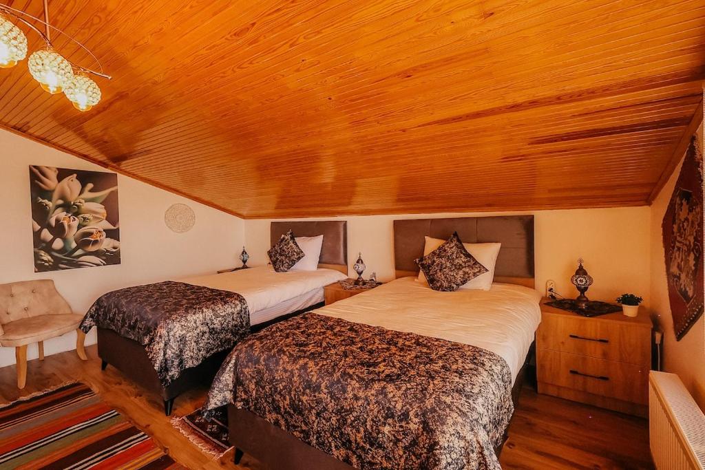 Postel nebo postele na pokoji v ubytování Taşkiran house