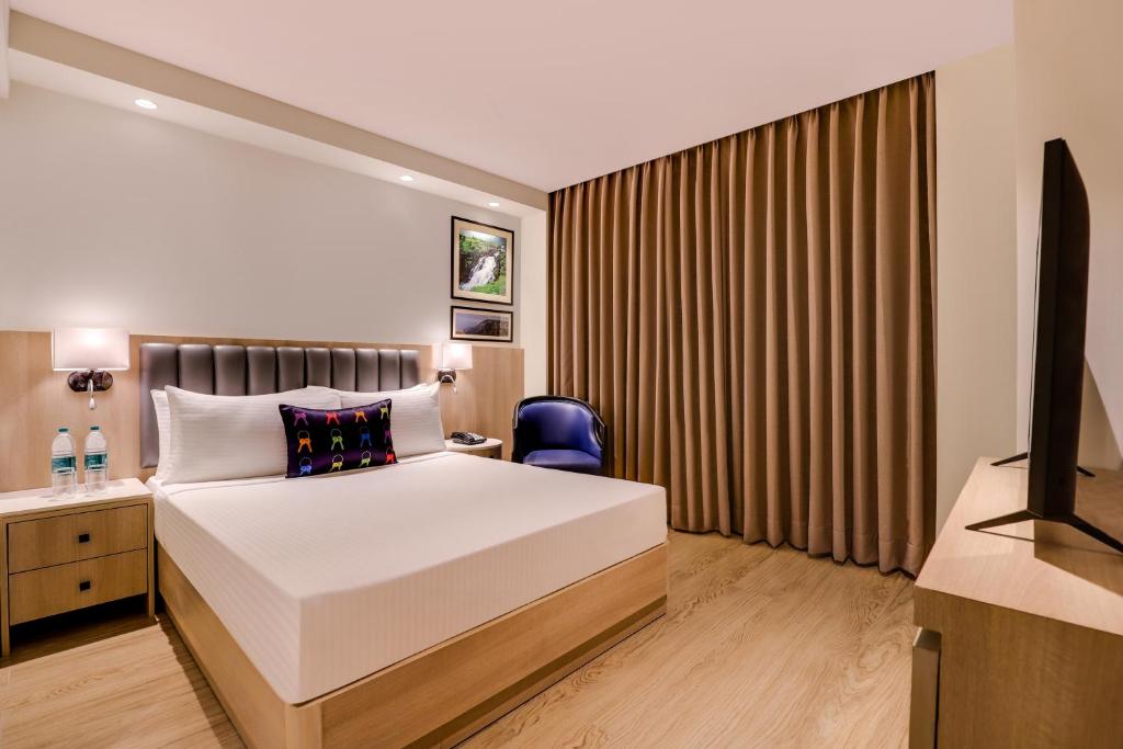 Postel nebo postele na pokoji v ubytování Keys Prima by Lemon Tree Hotels, Pimpri, Pune
