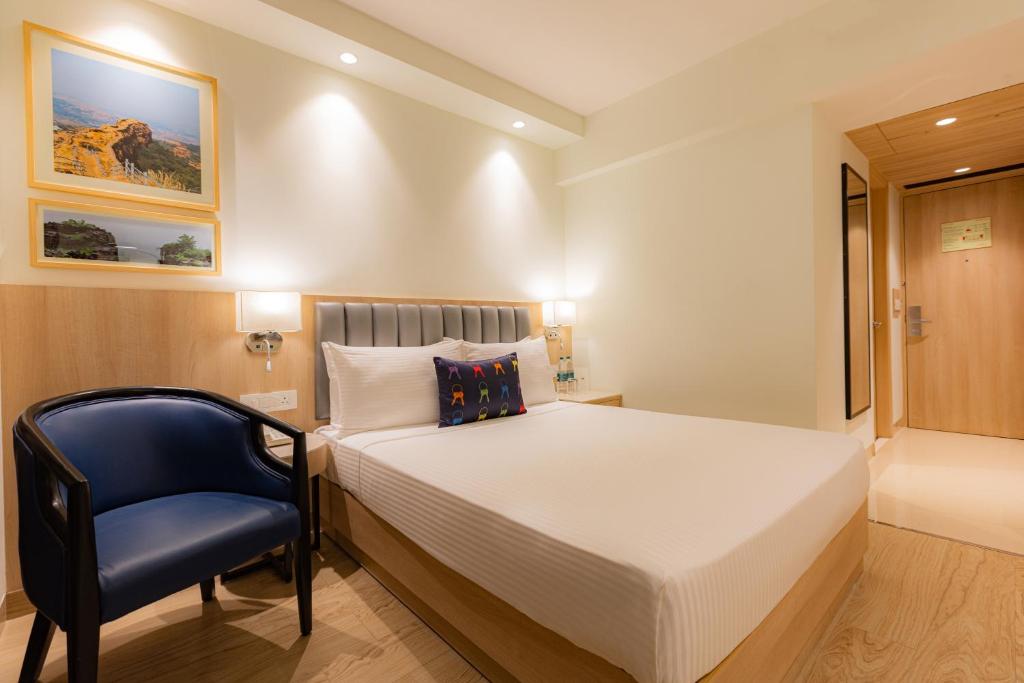 Postel nebo postele na pokoji v ubytování Keys Prima by Lemon Tree Hotels, Pimpri, Pune