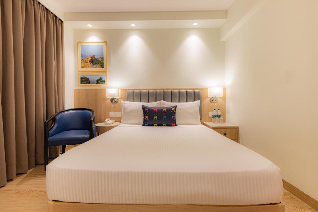 Postel nebo postele na pokoji v ubytování Keys Prima by Lemon Tree Hotels, Pimpri, Pune