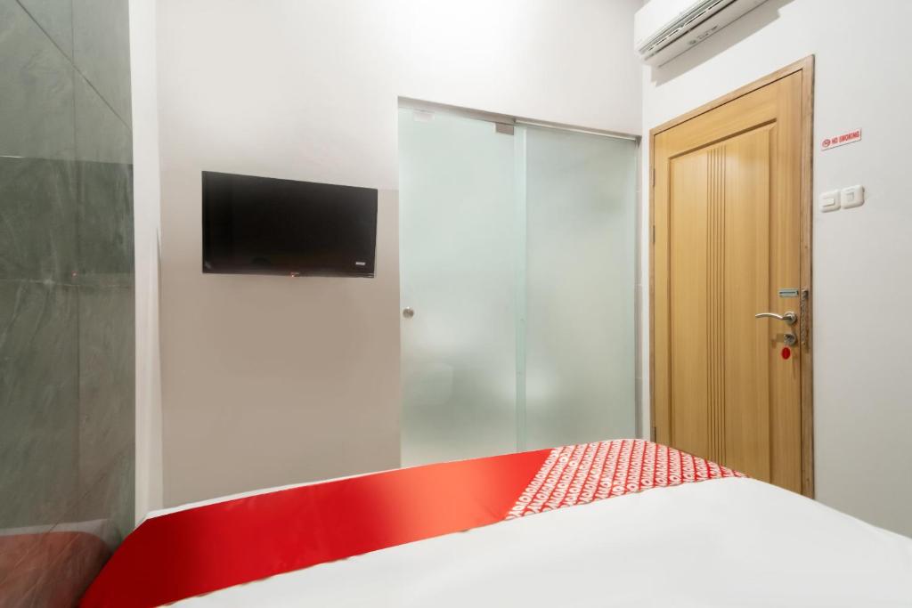 TV a/nebo společenská místnost v ubytování OYO 3159 Festive Inn