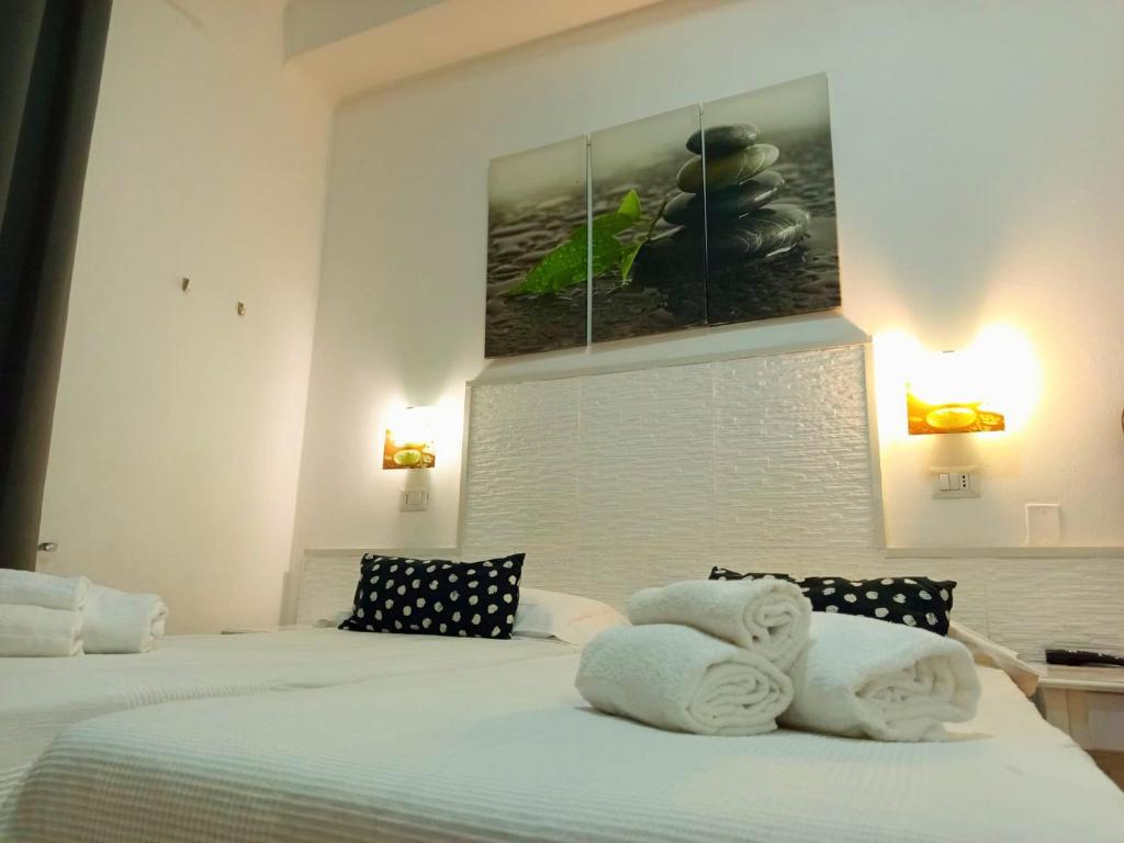 Postel nebo postele na pokoji v ubytování Hotel Birillo