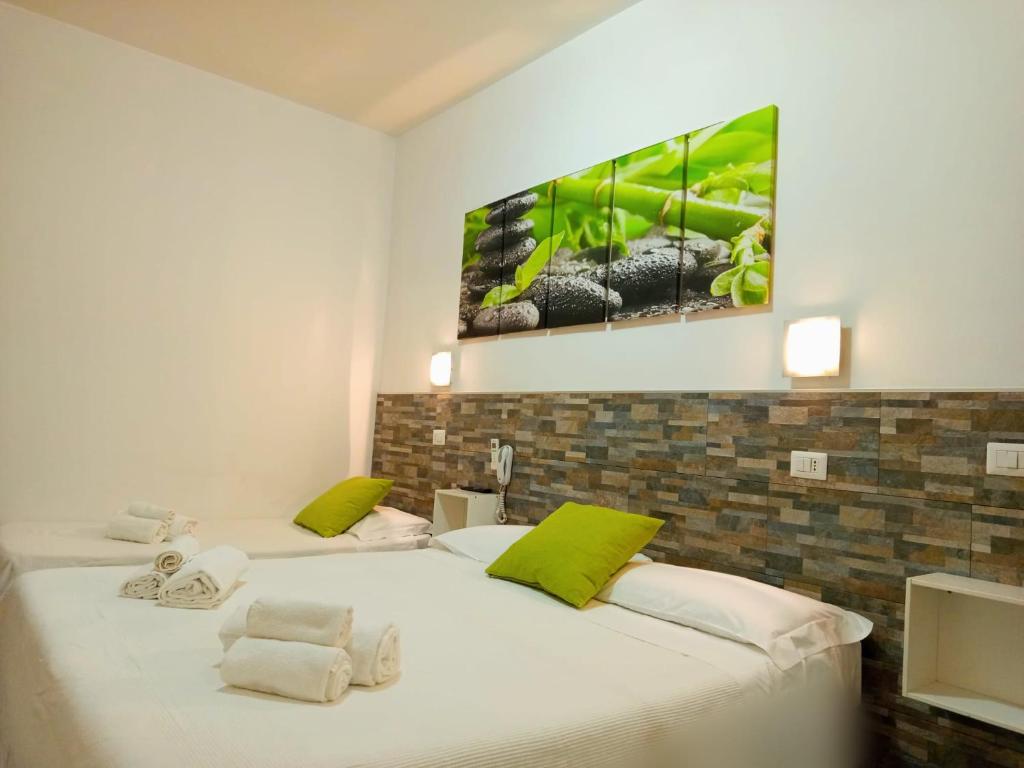 Postel nebo postele na pokoji v ubytování Hotel Birillo