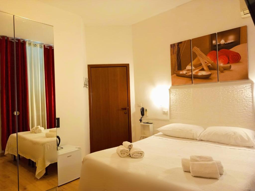 Postel nebo postele na pokoji v ubytování Hotel Birillo