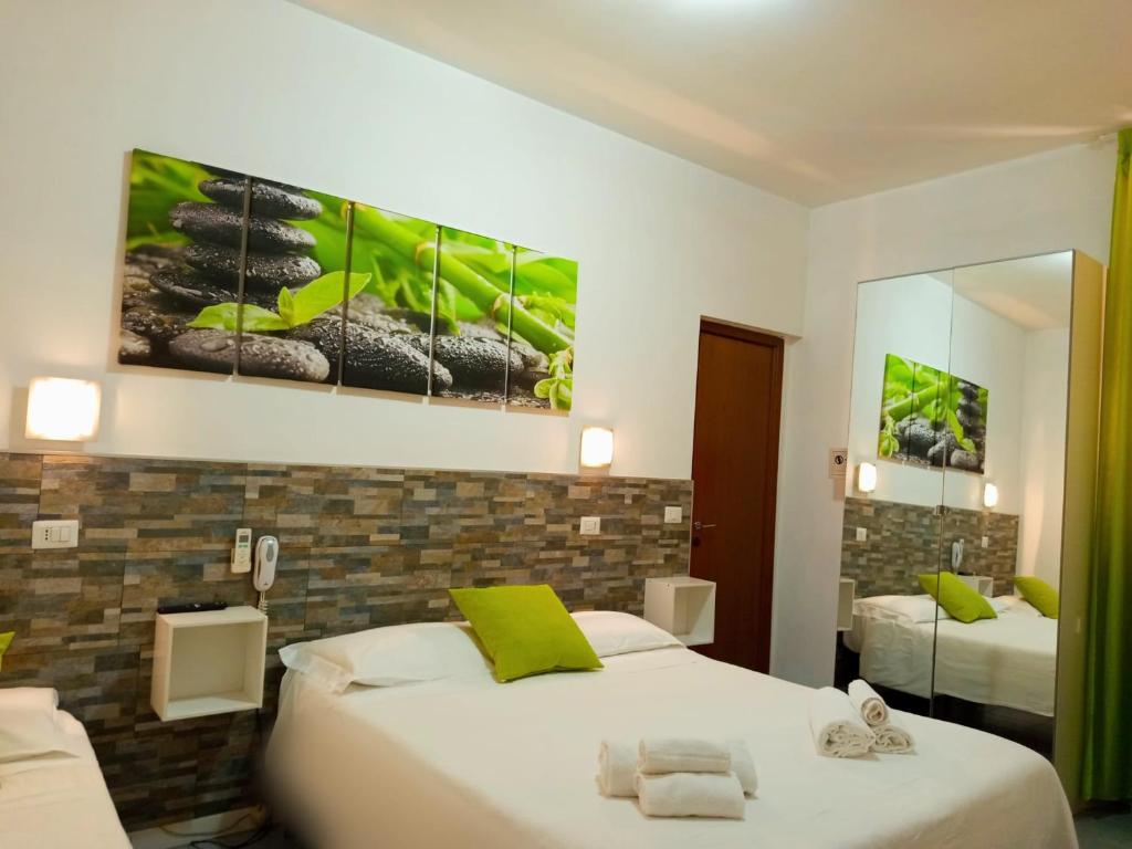 Postel nebo postele na pokoji v ubytování Hotel Birillo