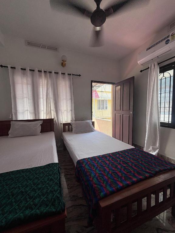 Postel nebo postele na pokoji v ubytování Hornbill inn