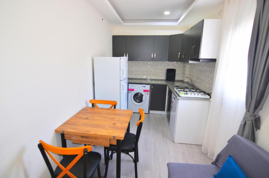 Kuchyň nebo kuchyňský kout v ubytování Royalis Apart Hotel