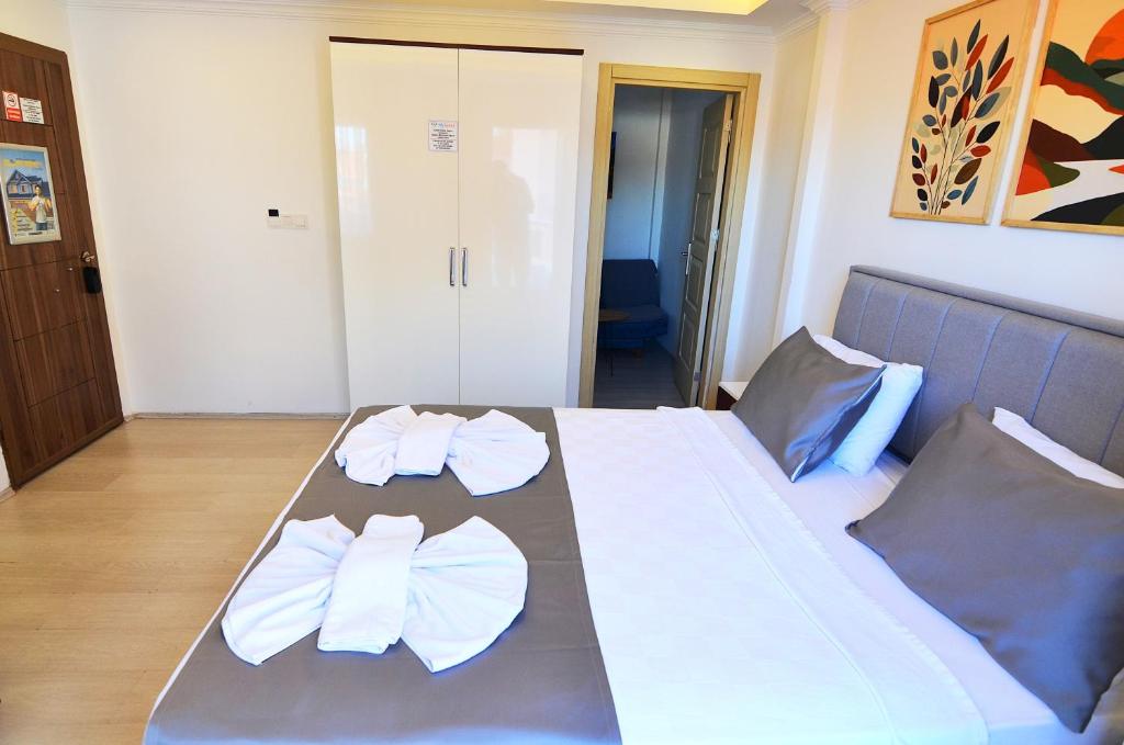 Postel nebo postele na pokoji v ubytování Royalis Apart Hotel