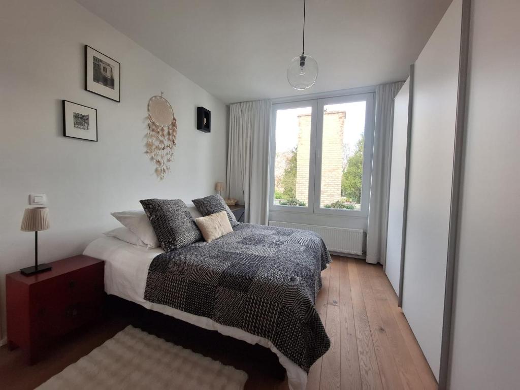Postel nebo postele na pokoji v ubytování B&B De Lelie