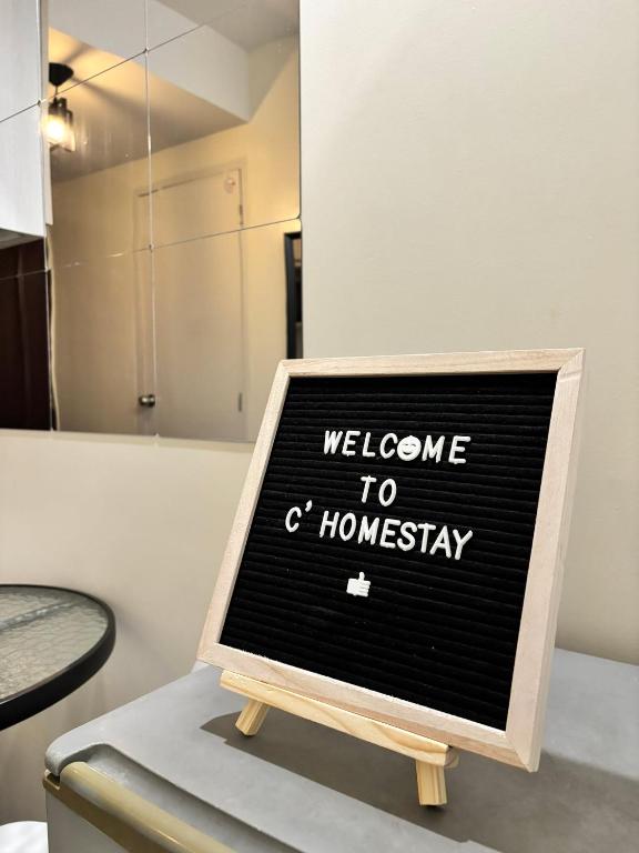 a sign that says welcome to a homaway at Fullerton suites C homestay in Silang