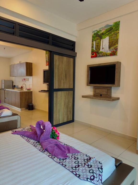 Postel nebo postele na pokoji v ubytování ATS Cameron Hotel & Apartments