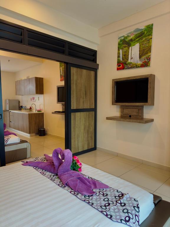 Postel nebo postele na pokoji v ubytování ATS Cameron Hotel & Apartments