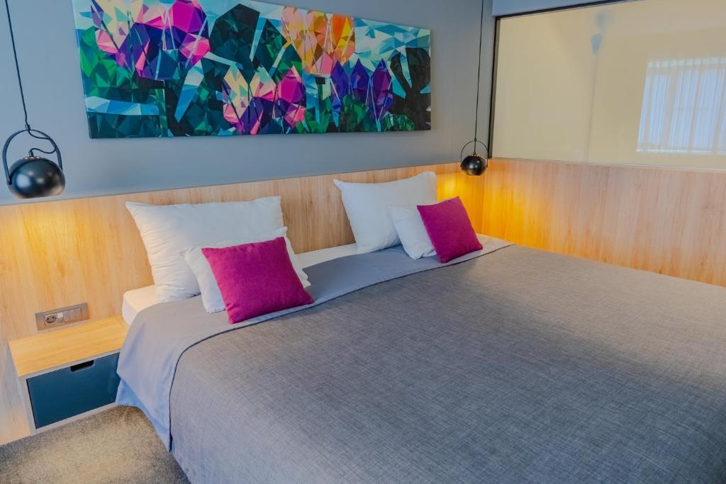 Posteľ alebo postele v izbe v ubytovaní Hotel Academia