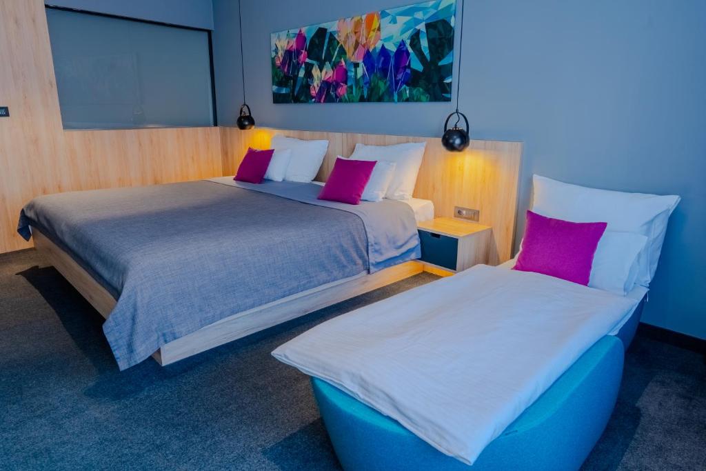 Posteľ alebo postele v izbe v ubytovaní Hotel Academia