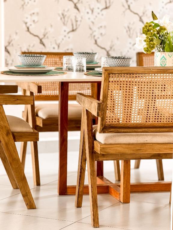 a dining room with a table and chairs at Marina Beachfront at JUMEIRAH PALM RESORT-NYALI in Mombasa