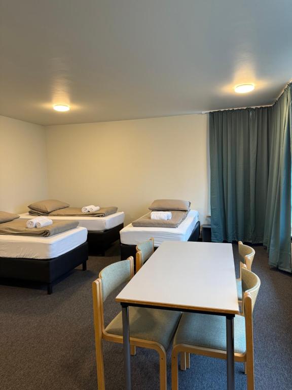 Postel nebo postele na pokoji v ubytování Skogar Hostel
