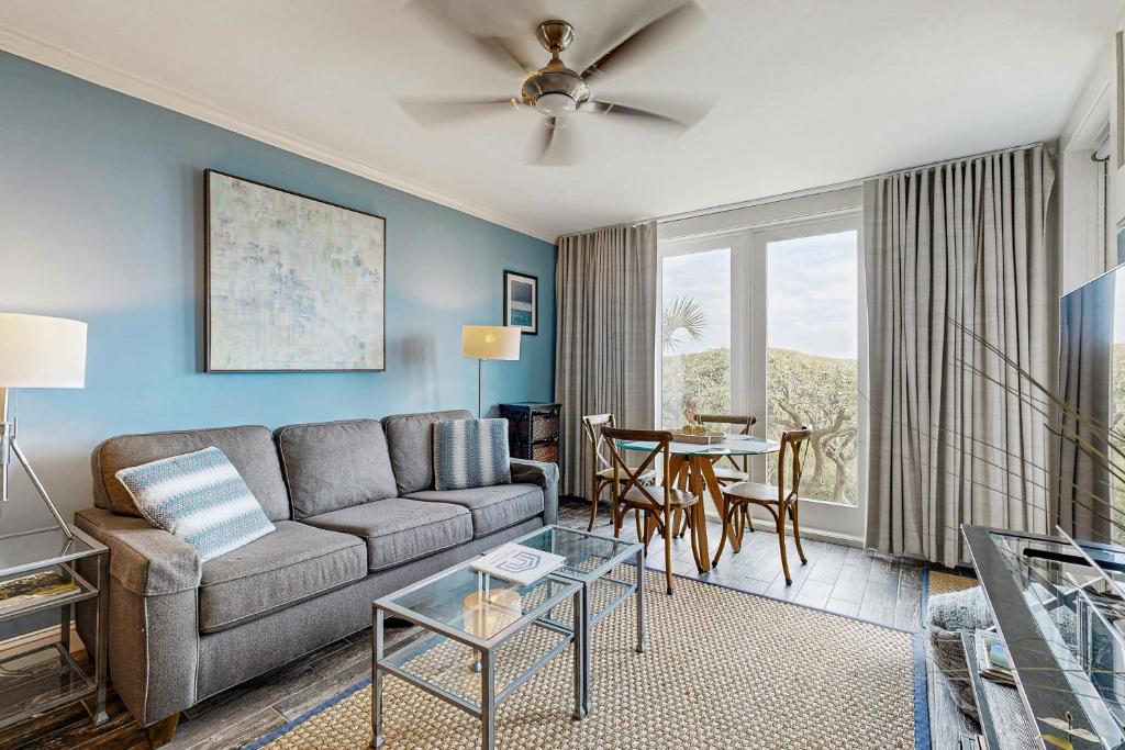 a living room with a couch and a table at Shipwatch 2373 in Kiawah Island