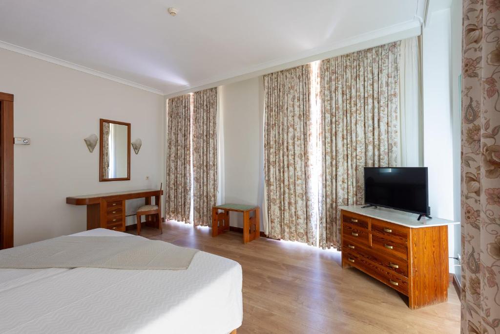 TV a/nebo společenská místnost v ubytování Hotel Universal