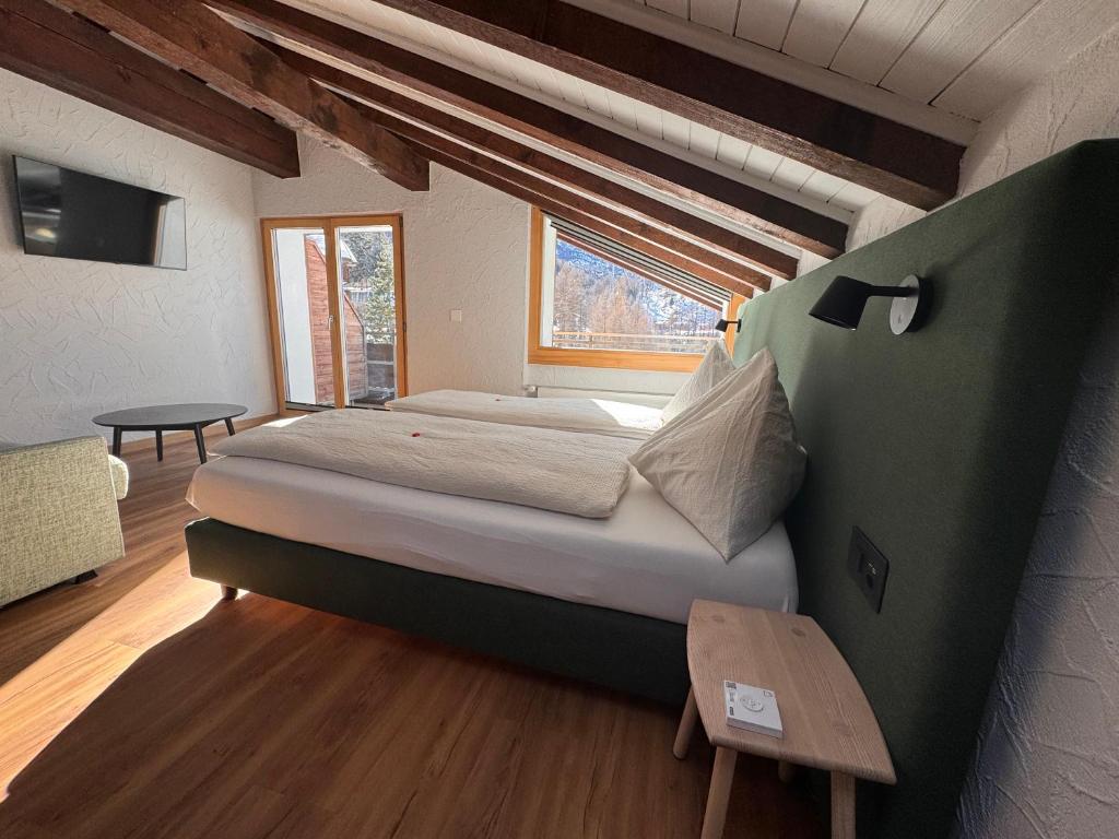 Postel nebo postele na pokoji v ubytování Hotel Plateau Rosa