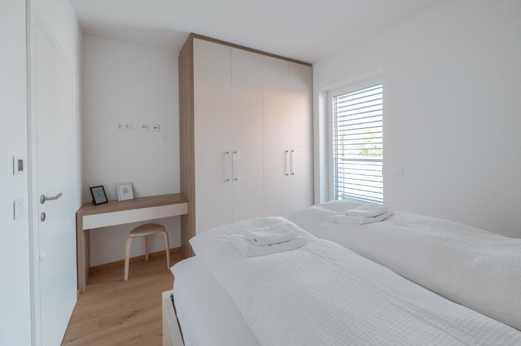 Postel nebo postele na pokoji v ubytování Amaria Downtown Aparthotel Villach