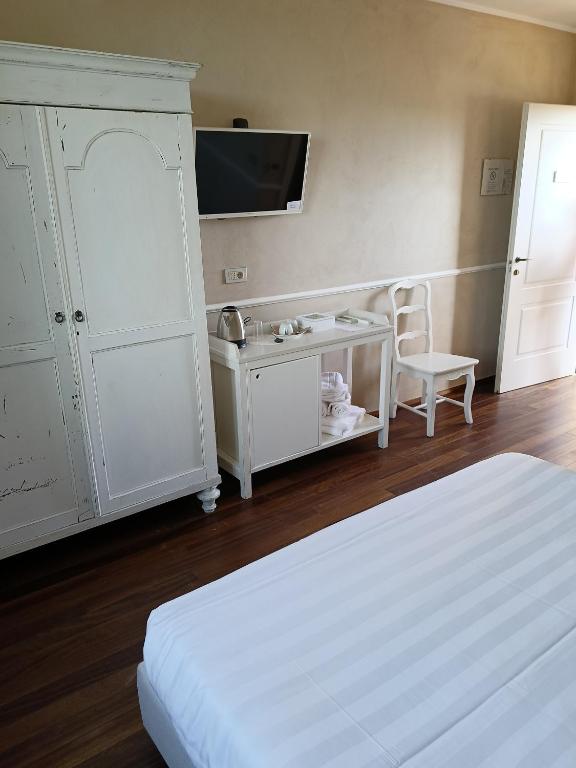 Postel nebo postele na pokoji v ubytování Agriturismo La Quercia