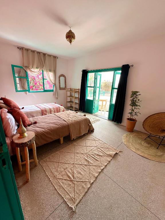 Postel nebo postele na pokoji v ubytování Dar Al-Andalus