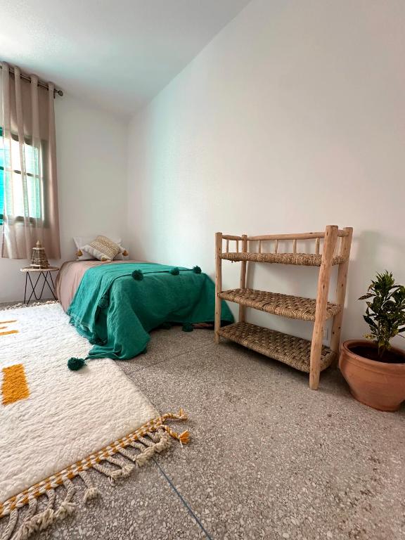 Postel nebo postele na pokoji v ubytování Dar Al-Andalus