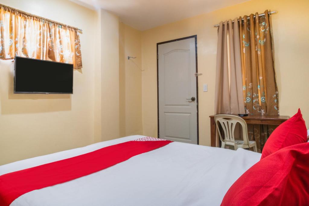 Postel nebo postele na pokoji v ubytování Super OYO 604 Chateau Cinco Dormitel