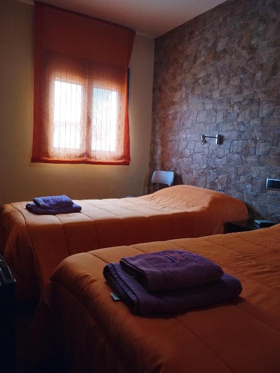 Postel nebo postele na pokoji v ubytování Pensión Matarraña