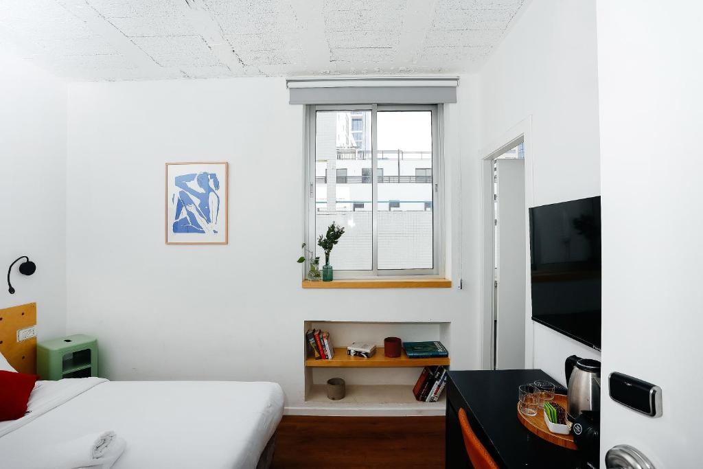 TV a/nebo společenská místnost v ubytování Domus Metro Hotel