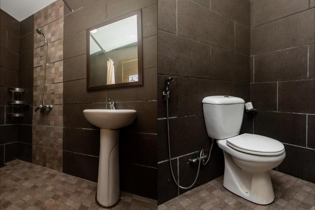 Koupelna v ubytování OYO 90059 Ltk Home