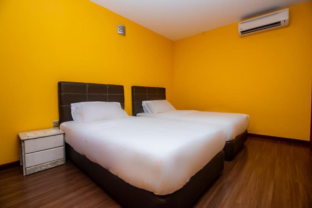 Postel nebo postele na pokoji v ubytování OYO 90059 Ltk Home