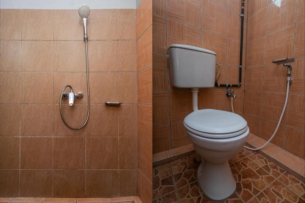 Koupelna v ubytování OYO 90059 Ltk Home