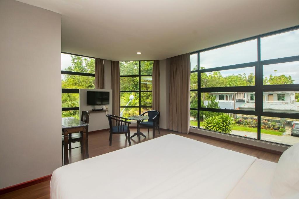 Postel nebo postele na pokoji v ubytování OYO 90059 Ltk Home