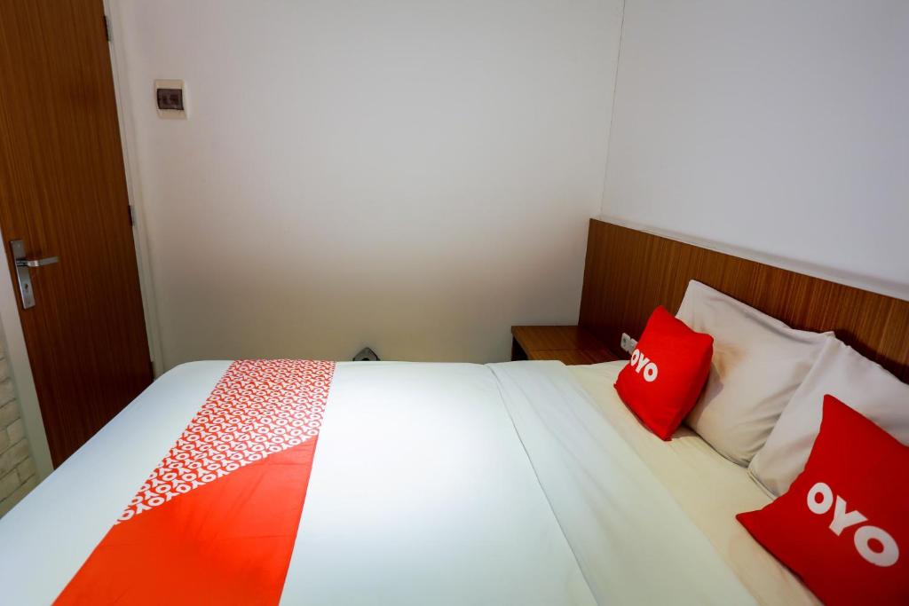 Postel nebo postele na pokoji v ubytování SUPER OYO 3109 Point Inn