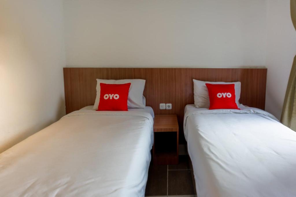 Postel nebo postele na pokoji v ubytování SUPER OYO 3109 Point Inn