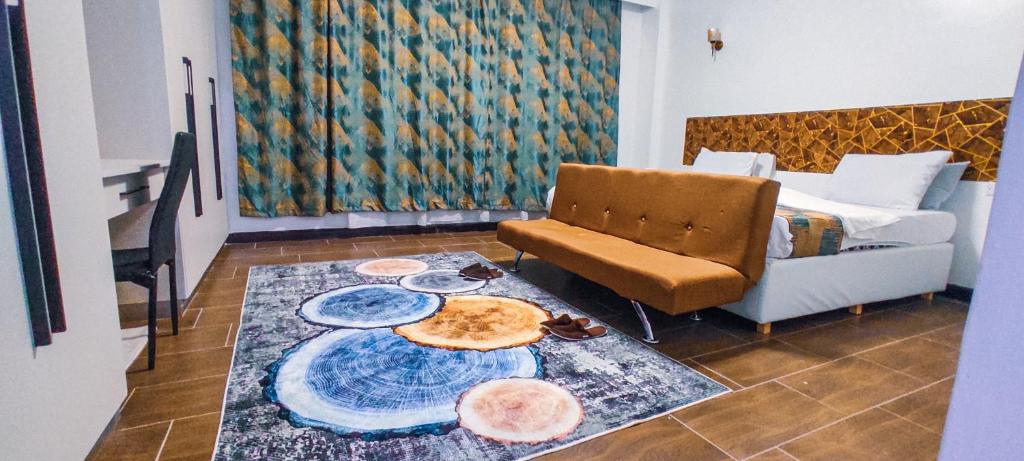 a living room with a couch and a table at Serene Hills Home in Nairobi