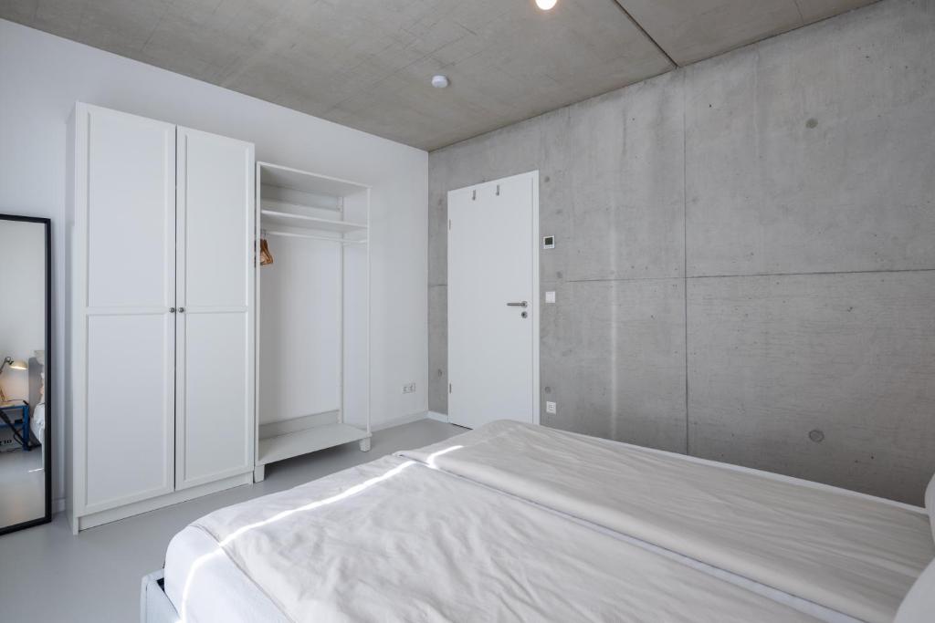 Postel nebo postele na pokoji v ubytování Weinberg-Design-Apartment Stuttgart-Fellbach