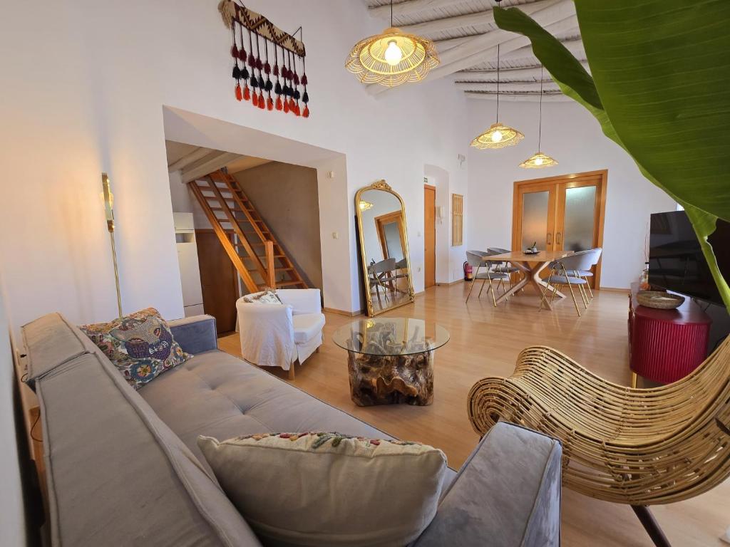a living room with a couch and a table at Urban Loft - La Conce in Cáceres