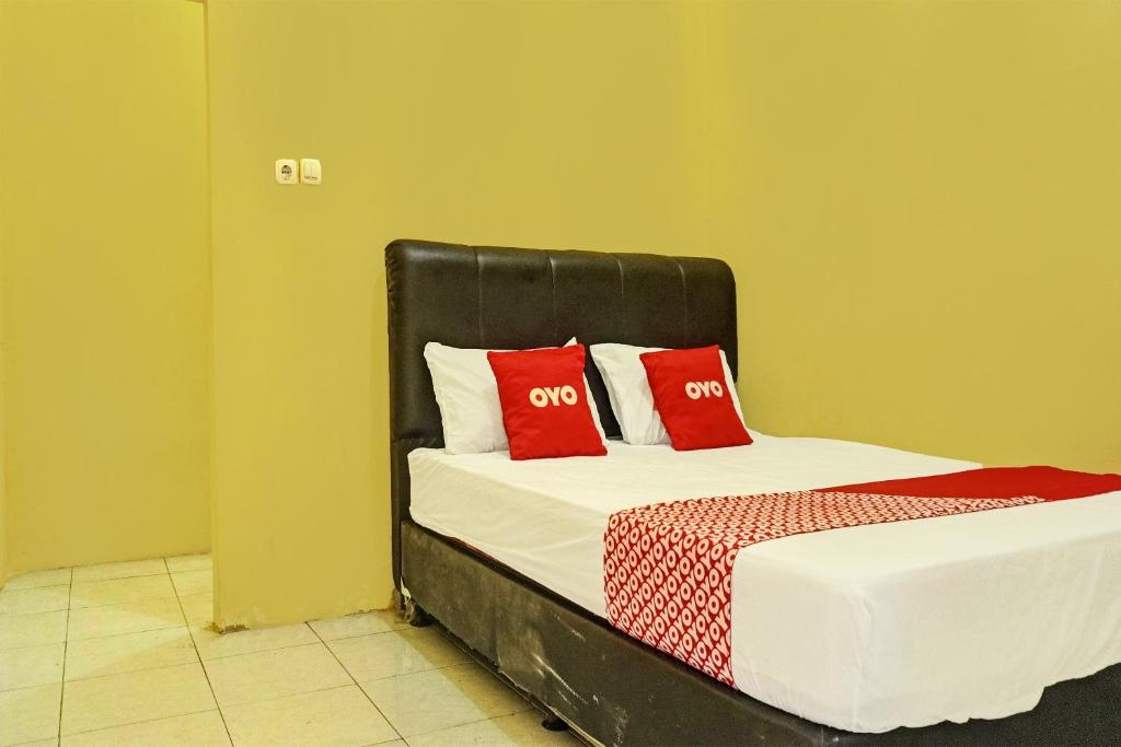 Ένα ή περισσότερα κρεβάτια σε δωμάτιο στο Hotel O Sweet Candy 1 Syariah