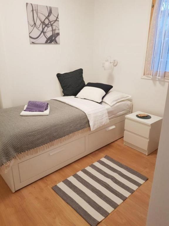 Posteľ alebo postele v izbe v ubytovaní Apartments Kike