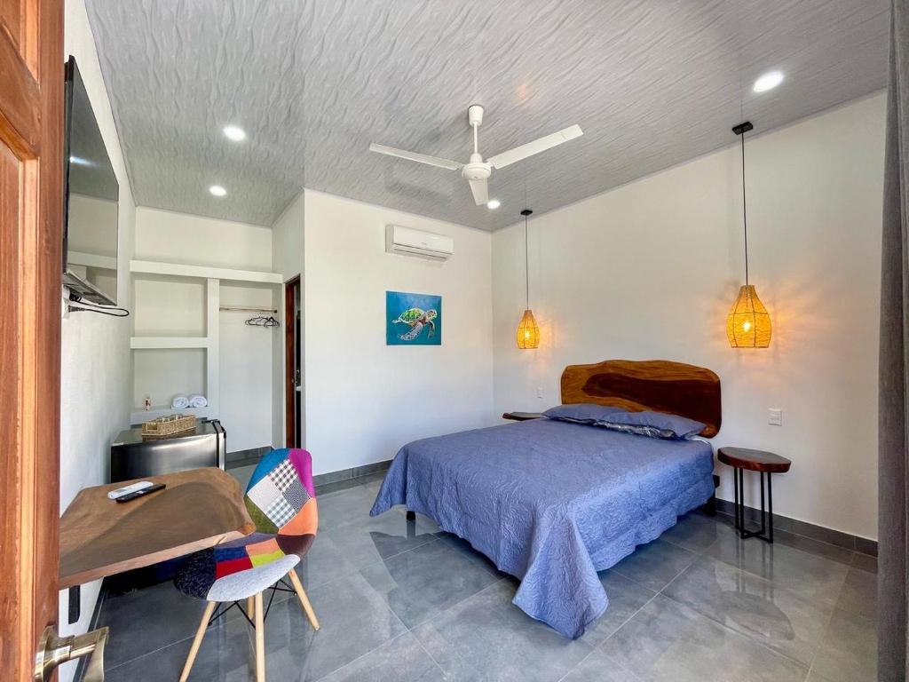 Postel nebo postele na pokoji v ubytování Hotel Huacas