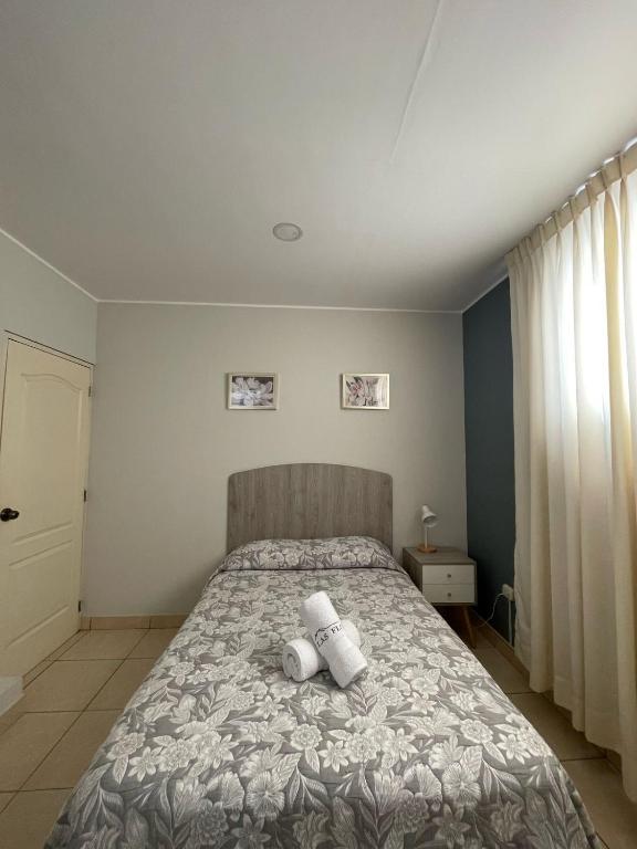 Postel nebo postele na pokoji v ubytování Casa Las Flores Ica