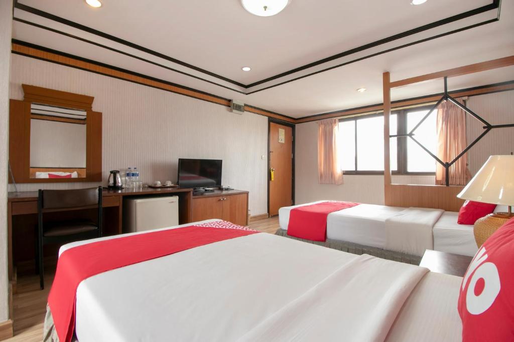 Postel nebo postele na pokoji v ubytování Hotel Win Long