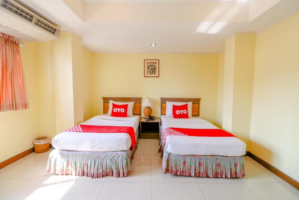 Postel nebo postele na pokoji v ubytování Hotel Win Long